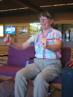 Dianne Roth works on
arm strength in the airport.